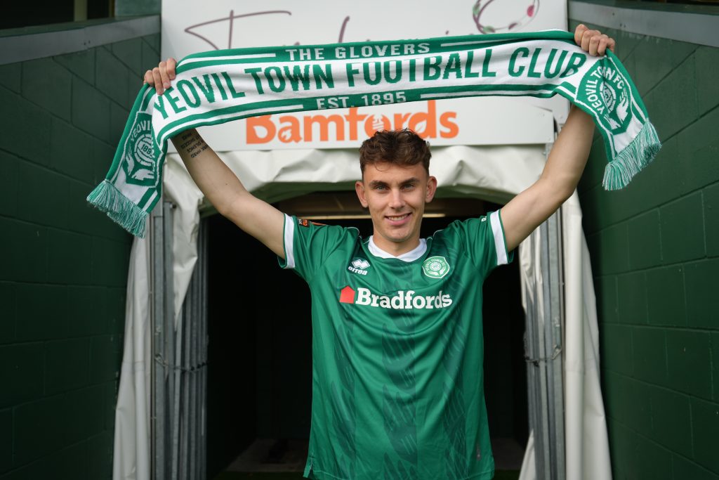 Caleb Hughes signs for the Glovers